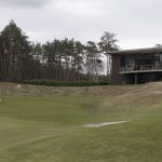 Mooie 9e green met het clubhuis op de achtergrond